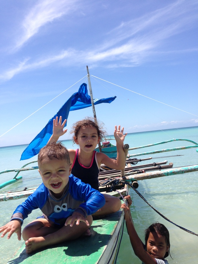 Kids on the boat: no, it is not so hard to get used to island life.